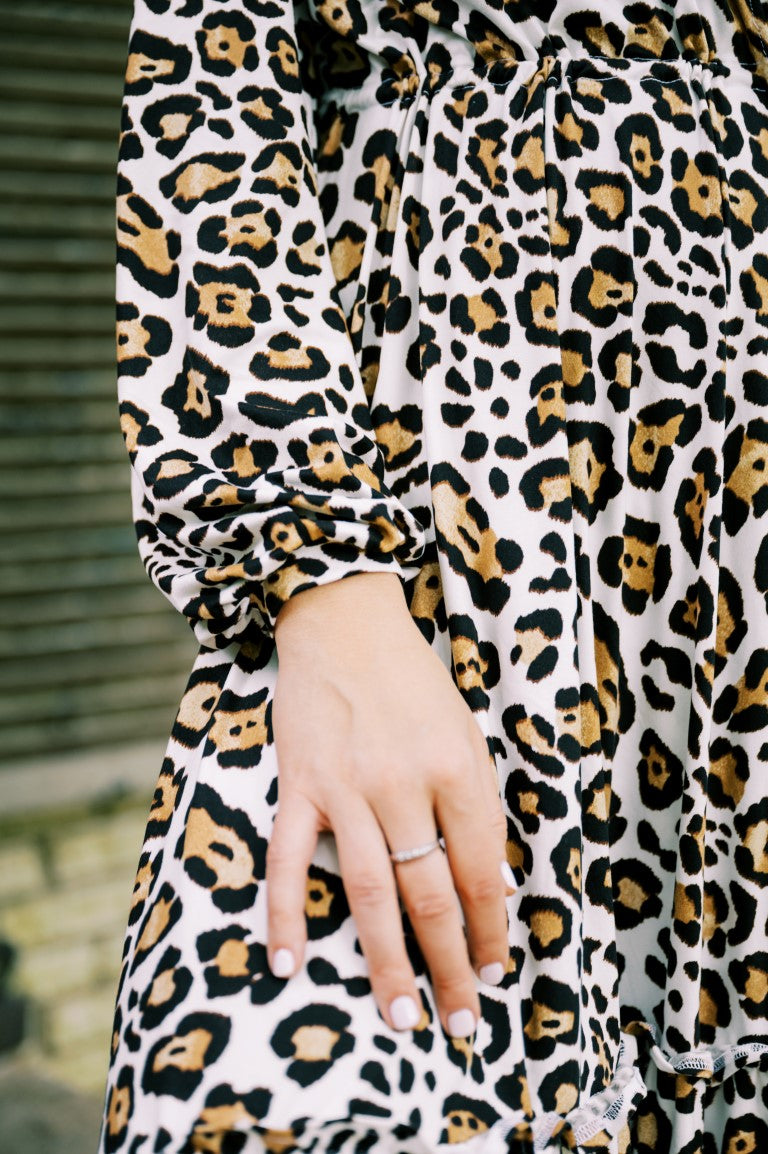 Cuffed Sleeves on a White Animal Print Robe